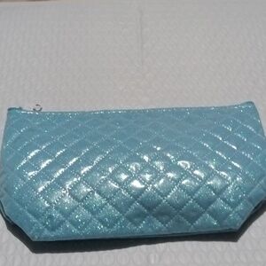 Light blue clutch with items